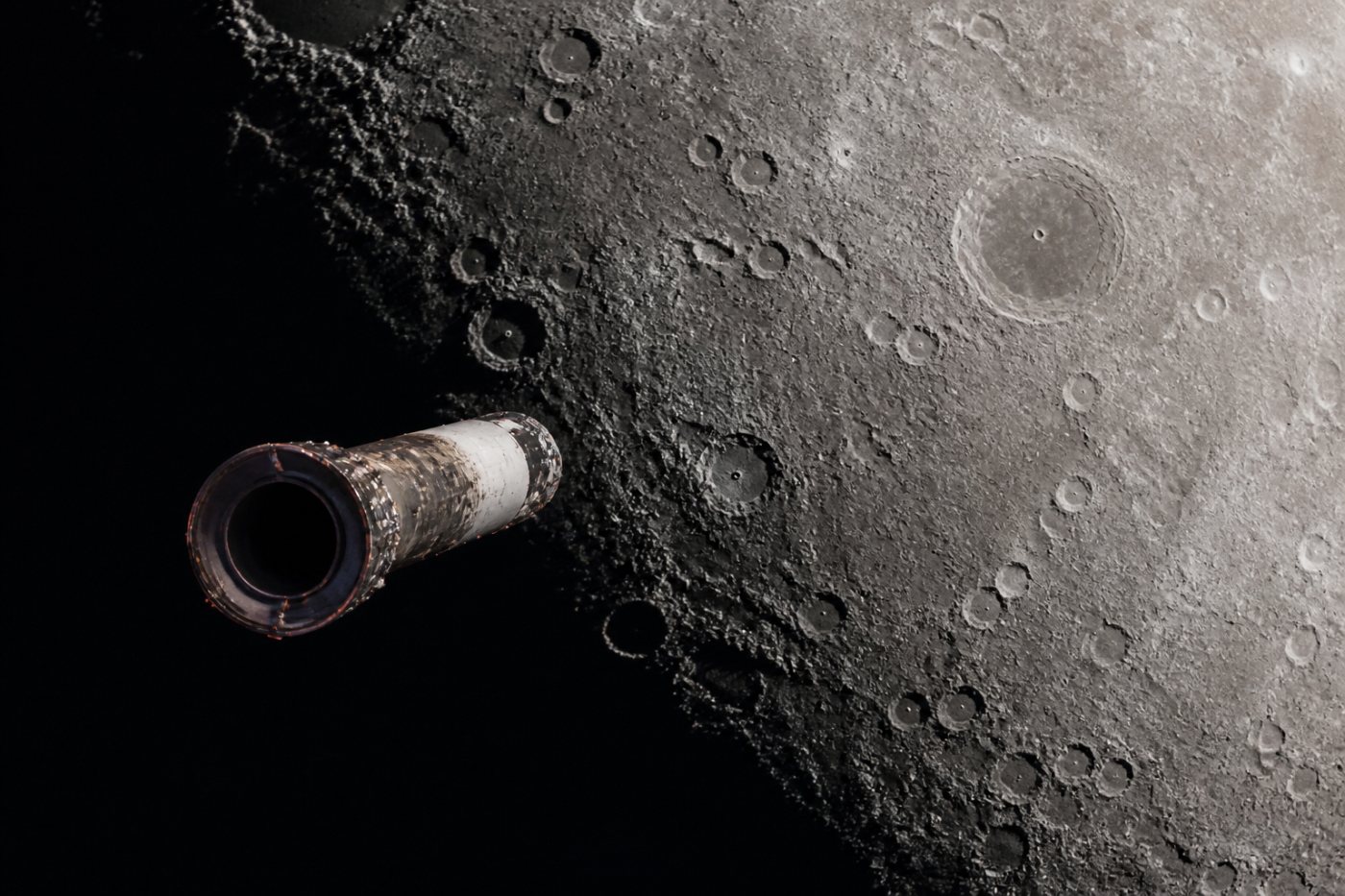 The spent Falcon 9 upper stage approaches its predicted impact point near Einstein crater on the sunlit lunar surface.
