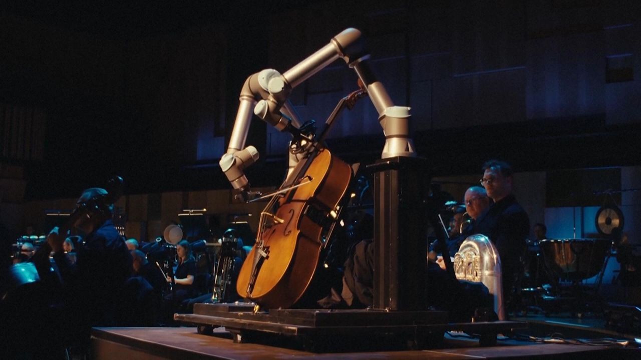 Robot Plays Cello With Live Orchestra