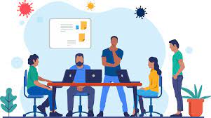 "Male adult engaging in seminar conversation at table in room with people"