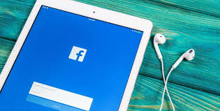 "Modern laptop and computer electronics with a first aid kit nearby."