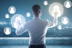 "Man photographing outdoors at night under moonlight with dramatic lighting."