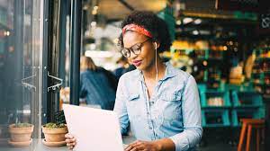 "Person sitting with head resting on hand, thoughtful expression on face."