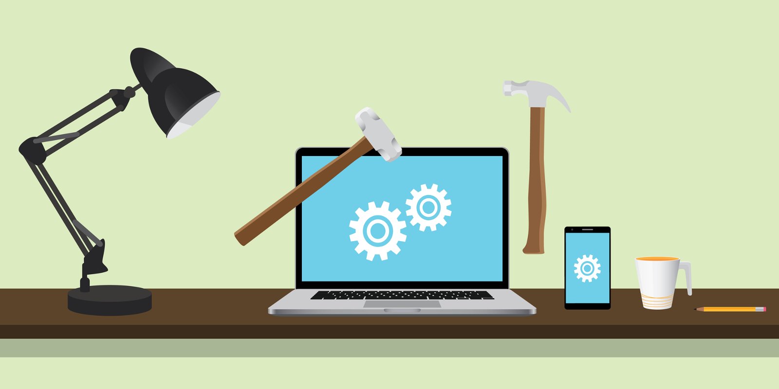 Настольная лампа, ноутбук, мобильный телефон и другая электроника на столе.