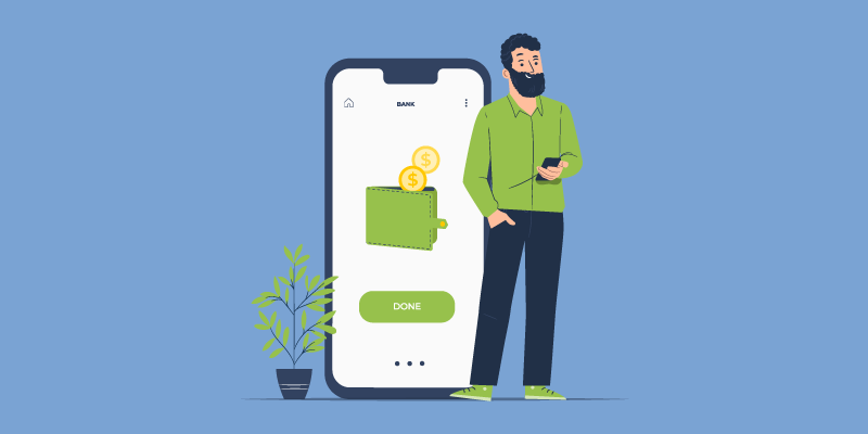 Мужчина-взрослый с телефоном в руках, смотрит на экран, окружен растениями.