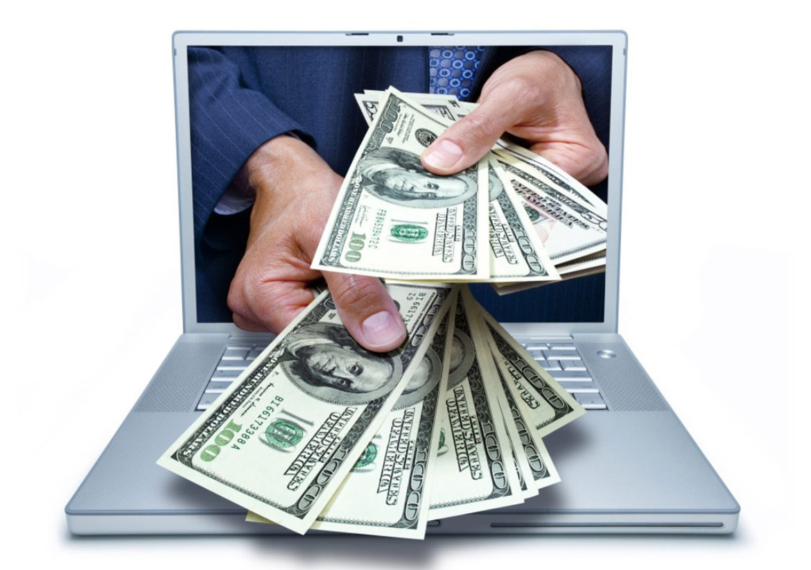 Ноутбук на фоне доллара - компьютер, электроника и деньги в одном изображении.