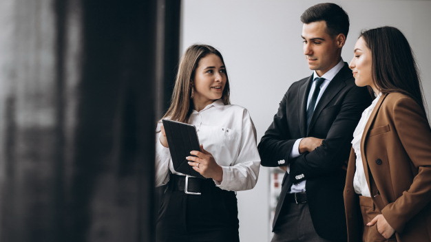 "Person wearing stylish coat engaged in lively conversation about fashionable clothing."
