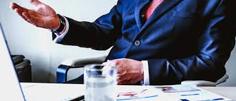 "Person wearing formal blazer and tie holding accessory, clothing, coat, jacket."