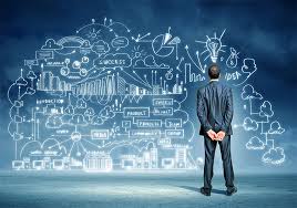 "Person writing on blackboard in classroom setting for educational concept."