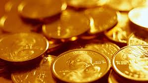 Монета из золота - сокровище и богатство на изображении.