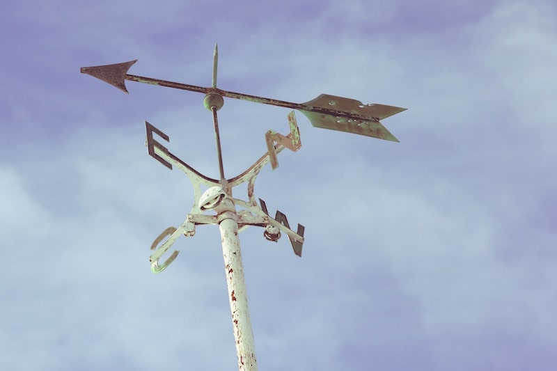 "Modern aircraft with weapon attachment, serving as a versatile transportation vehicle."