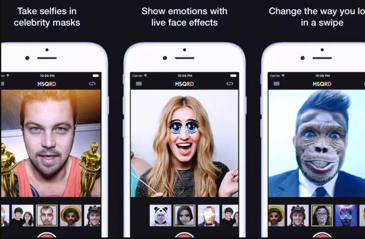 Электроника, мобильный телефон. Мужчина и женщина смотрят на экран телефона.