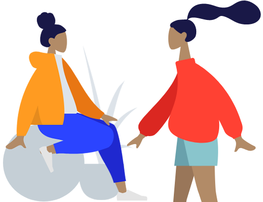 "Person walking in pants and coat, hands visible, face turned towards camera."