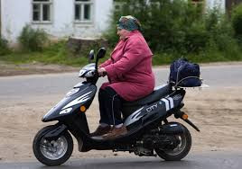 "Red motor scooter - transportation vehicle moped motorcycle concept image"